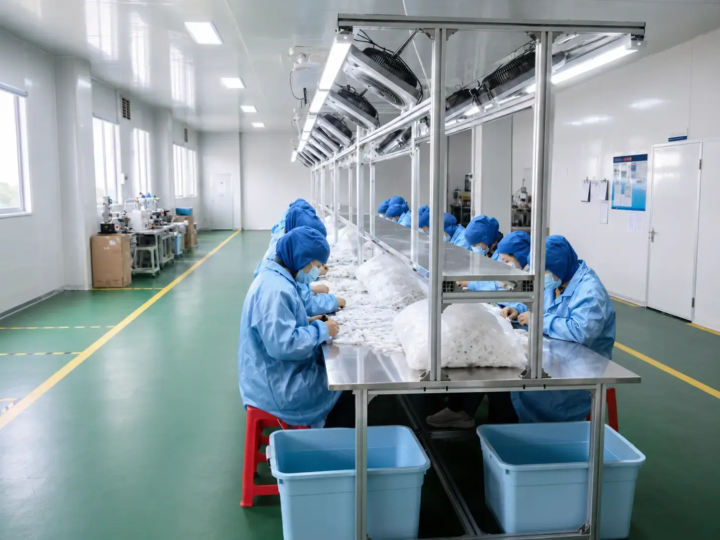 Workers assembling products in factory