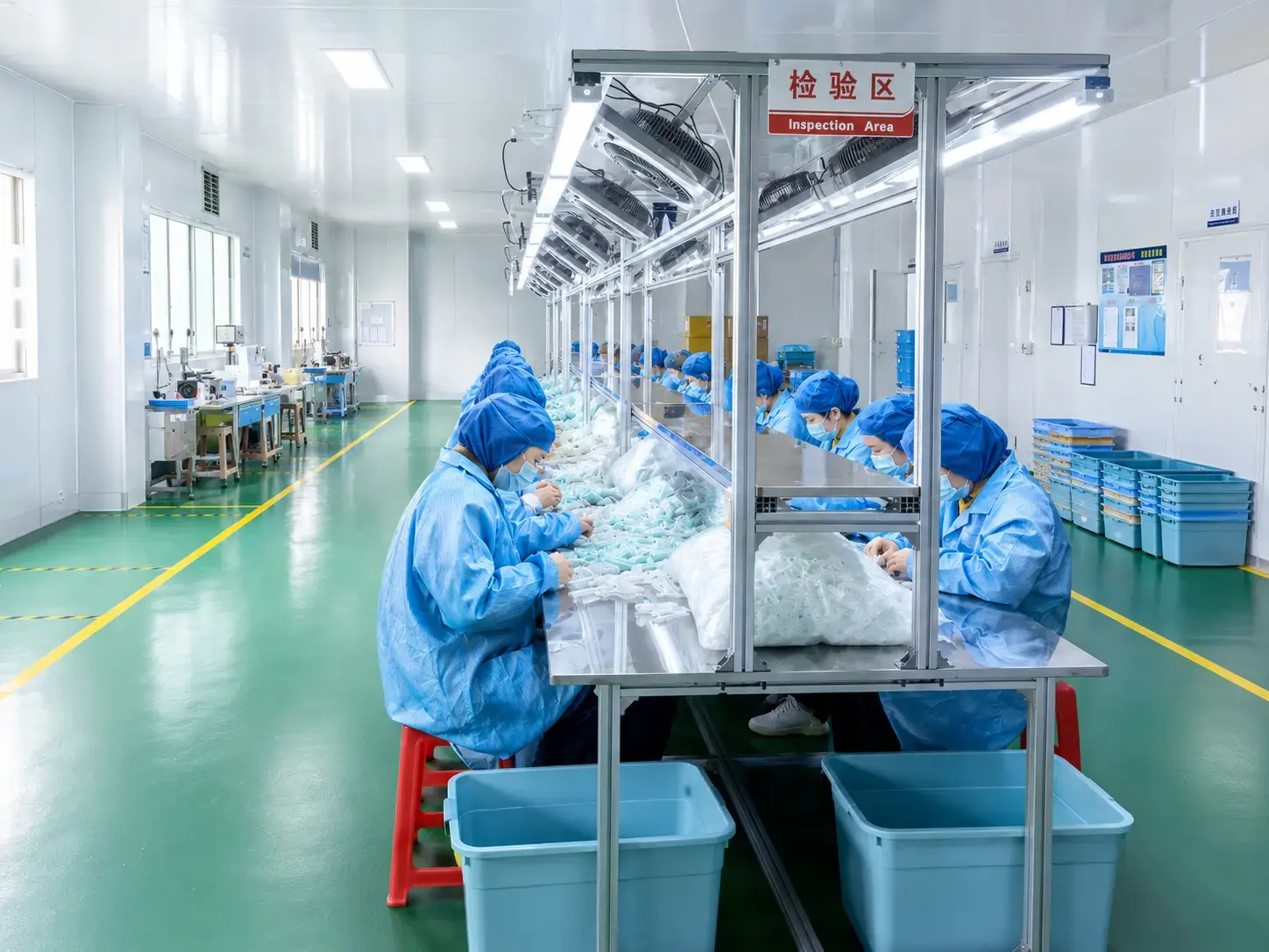 Inspection area with workers sorting products.